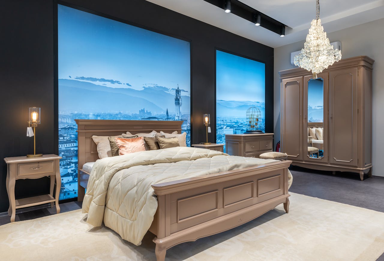 Interior of elegant bedroom with beige furniture and crystal chandelier