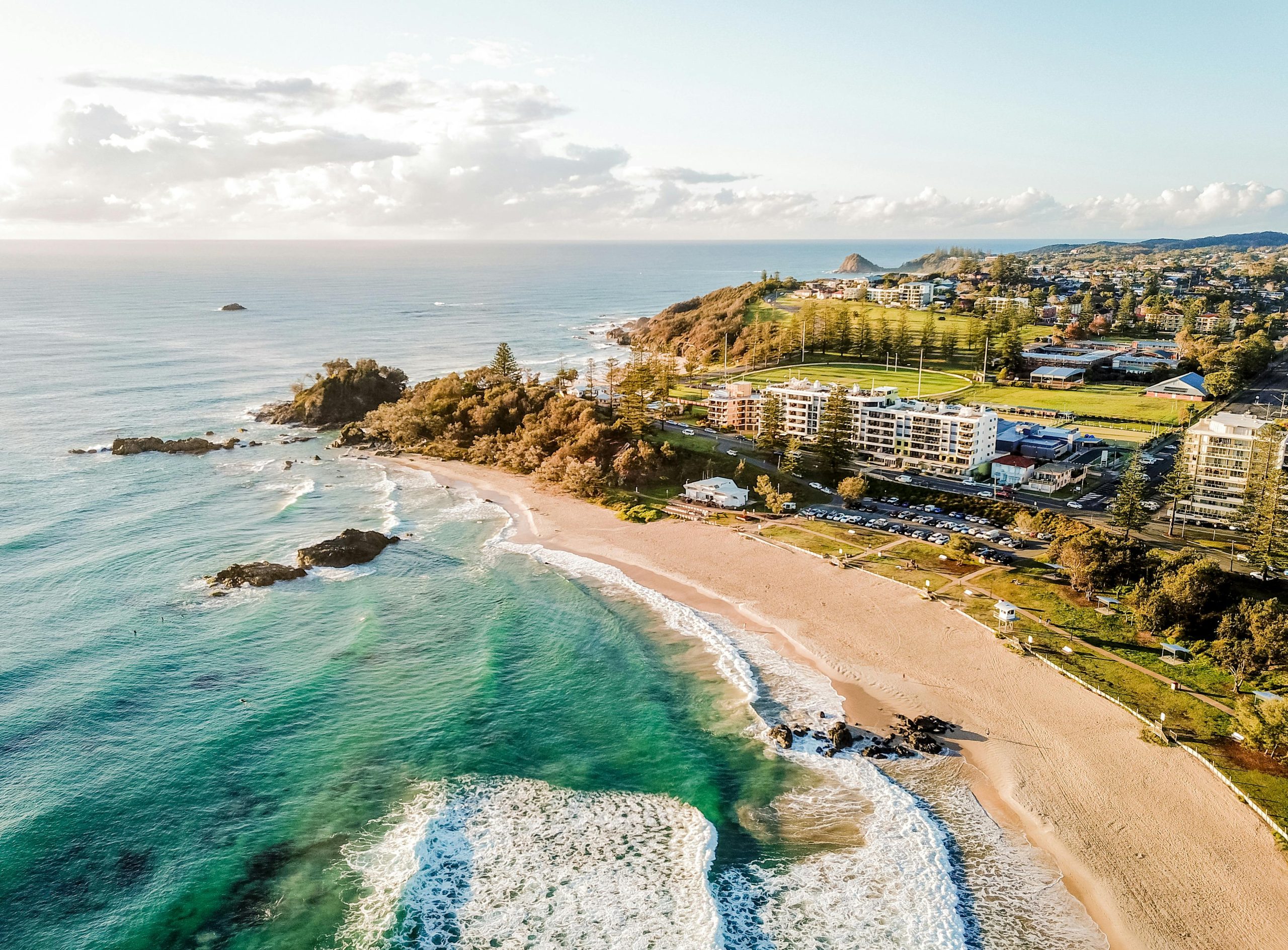 Stunning aerial view of Port Macquarie's sandy beaches and vibrant coastline, perfect for travel and tourism enthusiasts.